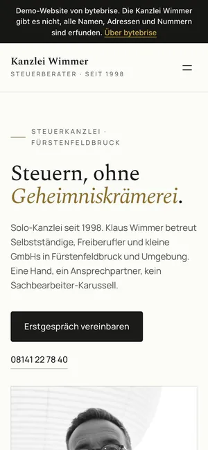 Kanzlei Wimmer on a phone